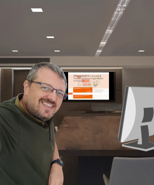 Enrique Zorío en una oficina con mesa de madera y pantalla interactiva al fondo con la web de enriquezorio.com
